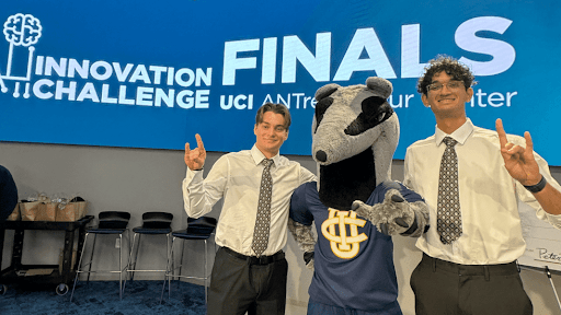 students Arjun Dabir and David Culciar pose with Peter the Anteater